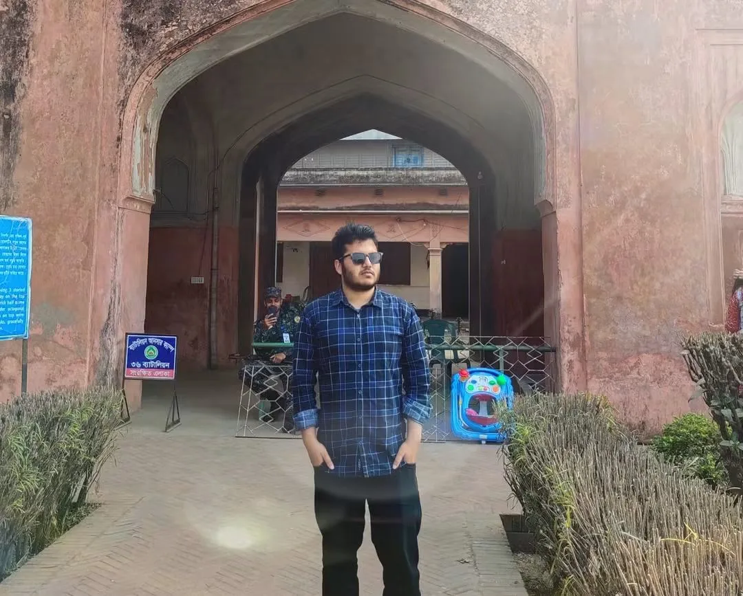 Asif Rezan posing beside historic architecture in Bangladesh