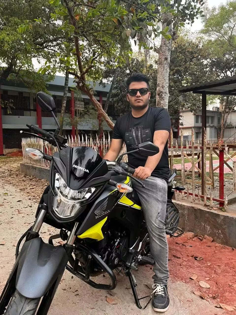 Asif Rezan photographed with a motorcycle in Bangladesh