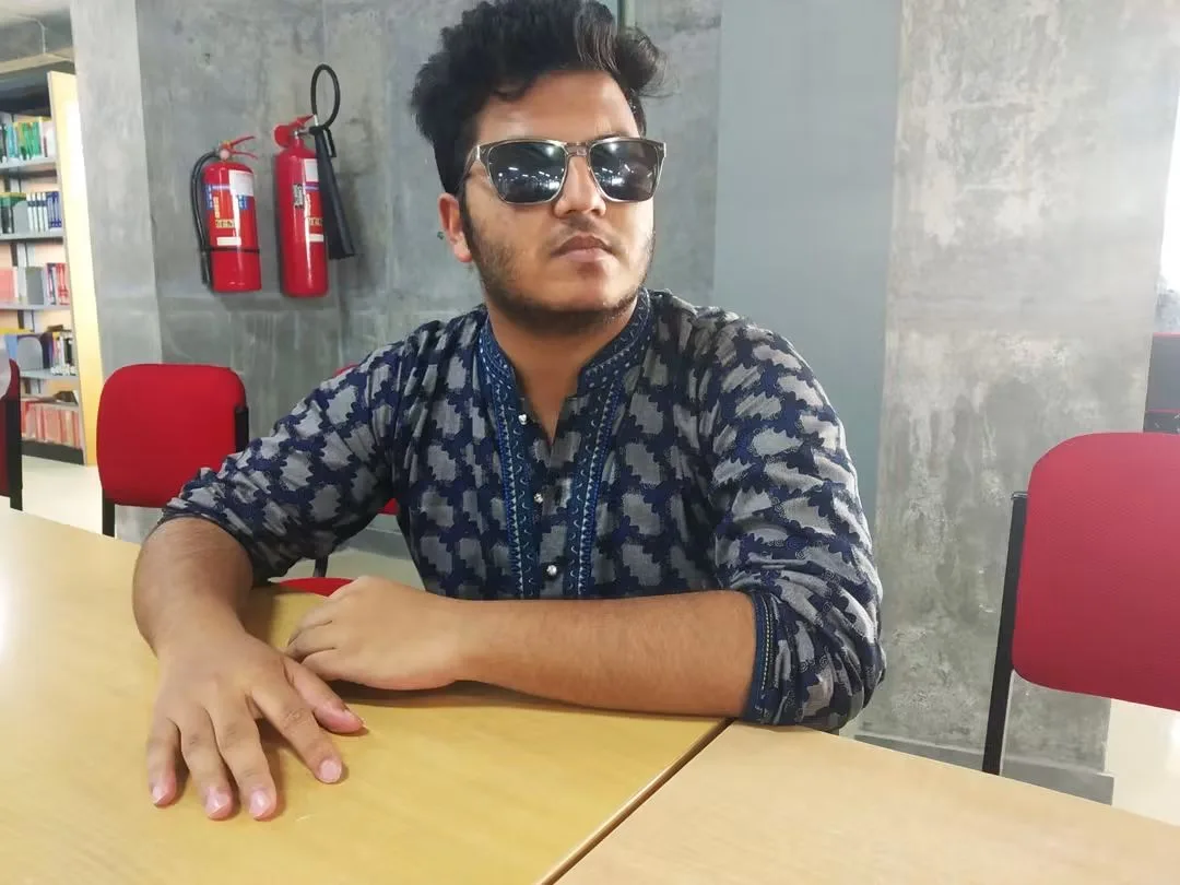 Asif Rezan wearing traditional Bangladeshi fashion and sunglasses